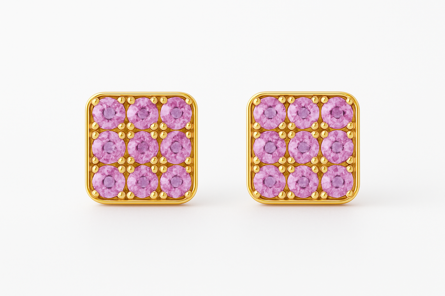 Square gold stud earrings featuring a grid of vivid pink sapphires set in a rounded-edge frame, with delicate gold bead prongs accentuating each stone. Displayed on a soft cream background with a subtle reflection.