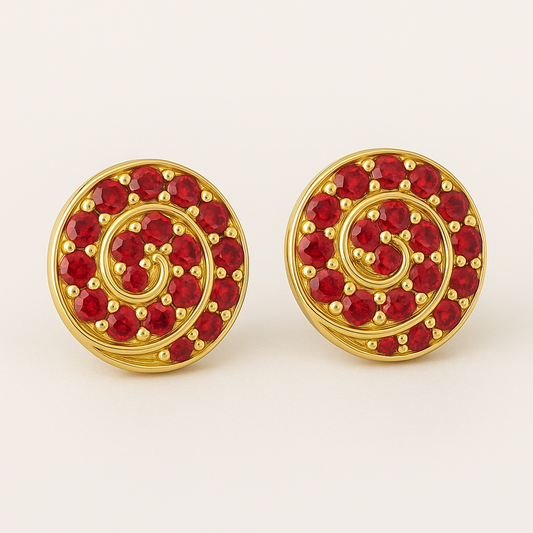 A pair of round gold stud earrings featuring a spiral design set with vibrant red rubies. Each earring showcases 14 gemstones intricately arranged along a golden swirl pattern, displayed against a soft cream background.