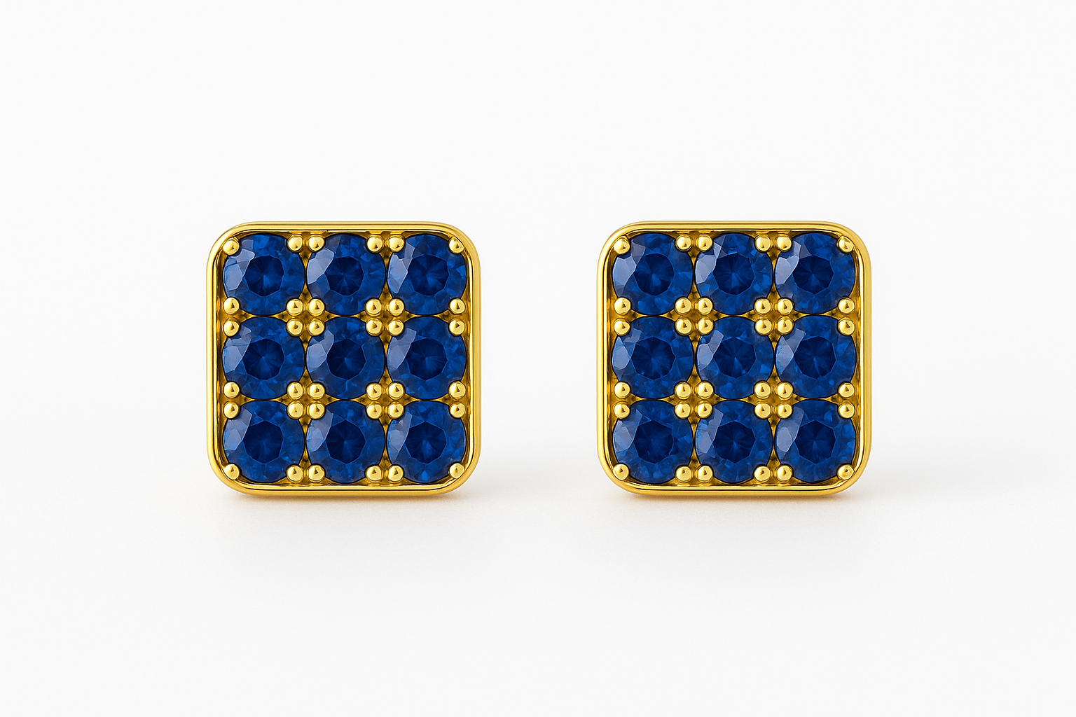 Square 18k gold stud earrings featuring a grid of vivid blue sapphires set in a rounded-edge frame, with delicate gold bead prongs accentuating each stone. Displayed on a soft cream background with a subtle reflection.